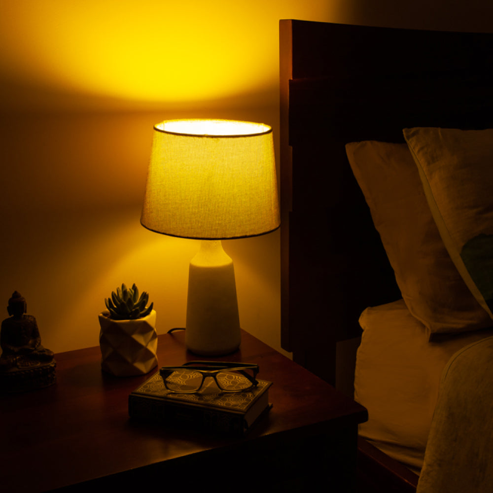 Yellow light glow from Lamp on bedside table