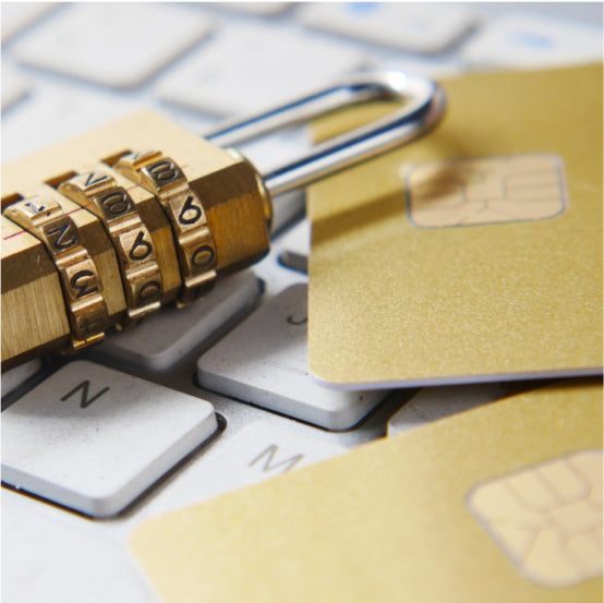 A padlock and chip on a computer keyboard